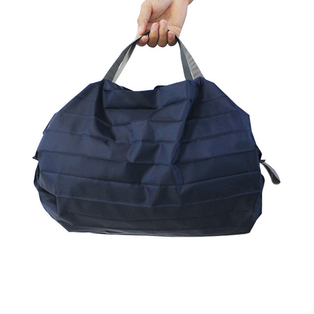 Foldable mini reusable grocery tote shopping bag in compact pouch form — view 10
