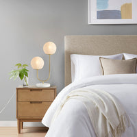 Modern metal two-light globe table lamp on bedside console — view 2