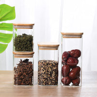 Sealed glass tea pot with bamboo lid storing loose leaf tea — view 4