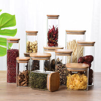 Sealed glass tea pot with bamboo lid storing loose leaf tea — view 3