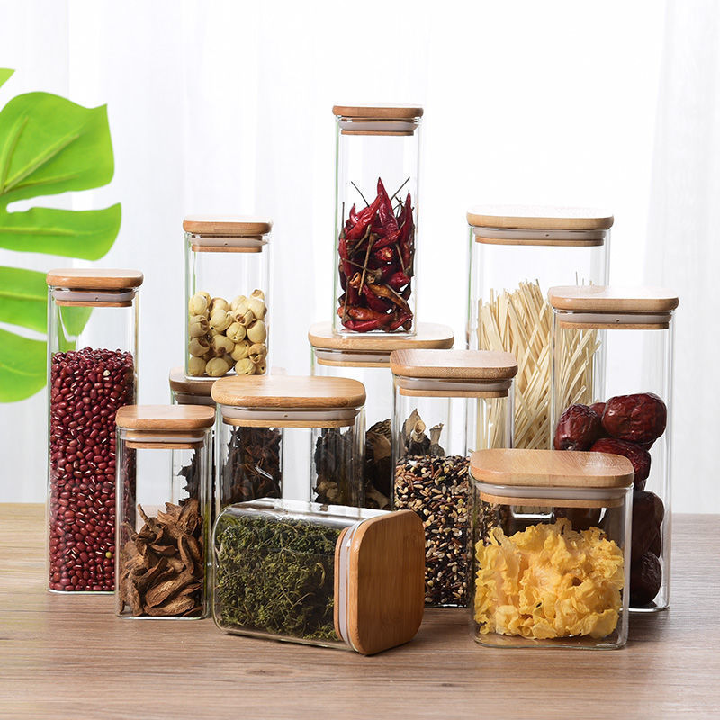 Sealed glass tea pot with bamboo lid storing loose leaf tea — view 3