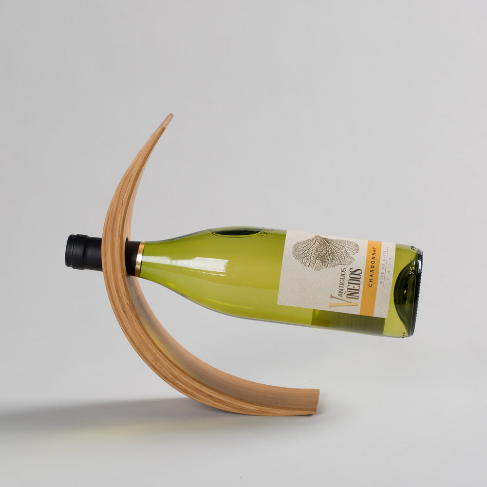 Creative sculptural wine bottle rack shelf on home bar counter