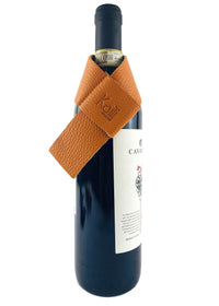 K0010LB | Bottle saver Made in Italy from genuine full-grain leather, dollar grain - Color Orange. Dimensions: 27 x 4 x 0.5 cm.  Packaging: hard bottom/cover Gift Box