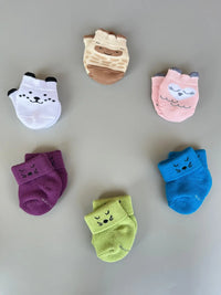 Air Garb baby combo socks for infants 0-1 years; a 6-pair collection arranged in a circle featuring animal faces like pink owl