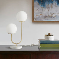 Modern metal two-light globe table lamp on bedside console — view 4