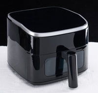 4-quart compact air fryer with digital controls on kitchen counter — view 2