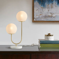 Modern metal two-light globe table lamp on bedside console