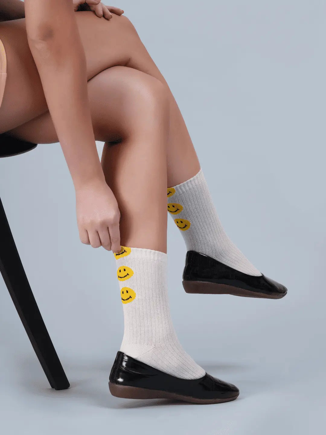 Bright yellow and colorful smiley face pattern printed on soft cotton women